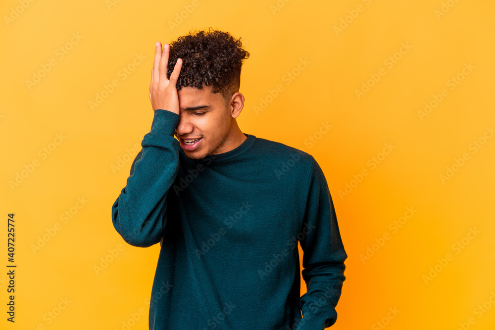 Young african american curly man isolated on purple forgetting something, slapping forehead with palm and closing eyes. Young african american curly man isolated on purple forgetting something, slapping forehead with palm and closing eyes.