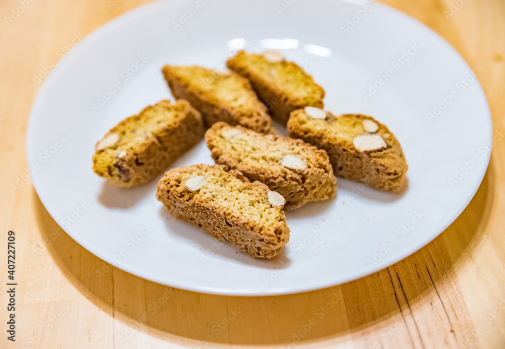 Biscotti cantuccini, Italian almond biscuits on a white plate Biscotti cantuccini, Italian almond biscuits on a white plate