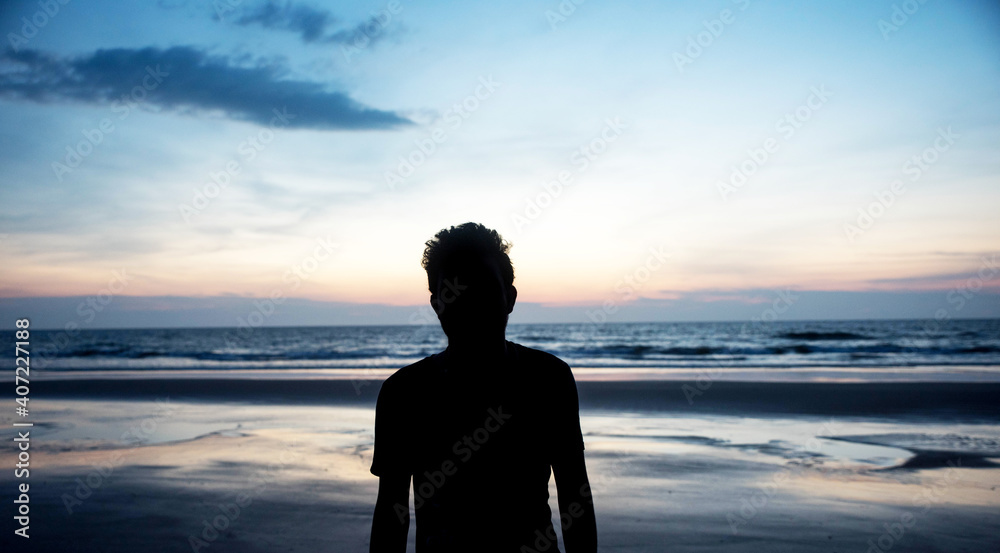 silhouette of people on the beach