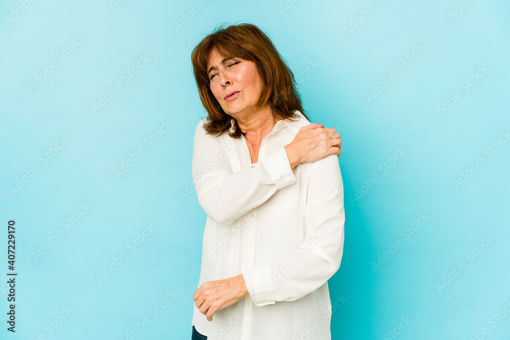 Senior caucasian woman isolated having a shoulder pain. Senior caucasian woman isolated having a shoulder pain.