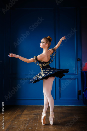 ballet dancer on blue wall background