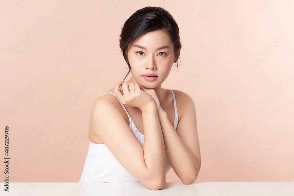 Beautiful young asian woman with clean fresh skin on beige background, Face care, Facial treatment, Cosmetology, beauty and spa, Asian women portrait Beautiful young asian woman with clean fresh skin on beige background, Face care, Facial treatment, Cosmetology, beauty and spa, Asian women portrait