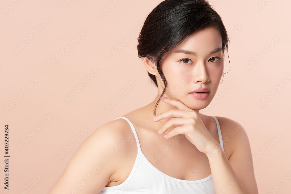 Beautiful young asian woman with clean fresh skin on beige background, Face care, Facial treatment, Cosmetology, beauty and spa, Asian women portrait Beautiful young asian woman with clean fresh skin on beige background, Face care, Facial treatment, Cosmetology, beauty and spa, Asian women portrait