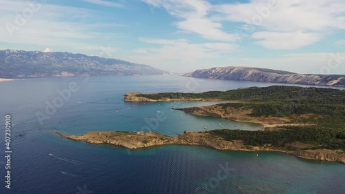 Aerial drone footage of the idyllic sandy beach of Ciganka of the Rab island in the Dalmatia region of Croatia in the Adriatic sea.  photo