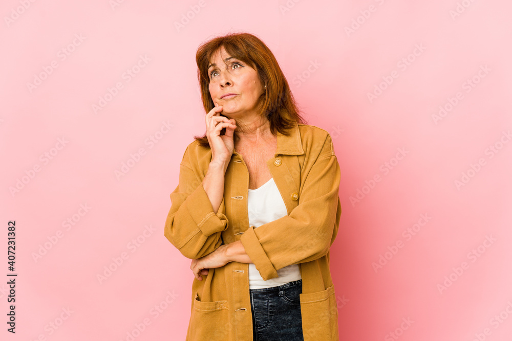 Senior caucasian woman isolated contemplating, planning a strategy, thinking about the way of a business. Senior caucasian woman isolated contemplating, planning a strategy, thinking about the way of a business.