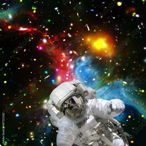 Astronaut and starfield. The elements of this image furnished by NASA.