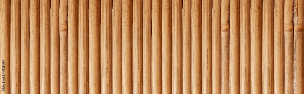 Panorama of Old brown bamboo fence pattern and seamless background Panorama of Old brown bamboo fence pattern and seamless background