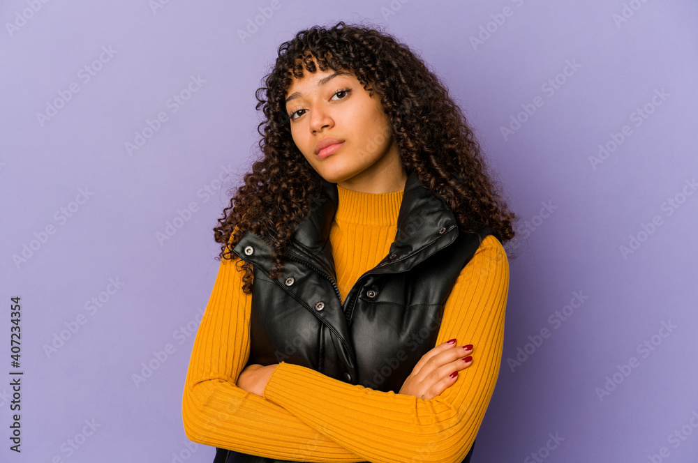Young african american afro woman isolated who is bored, fatigued and need a relax day. Young african american afro woman isolated who is bored, fatigued and need a relax day.