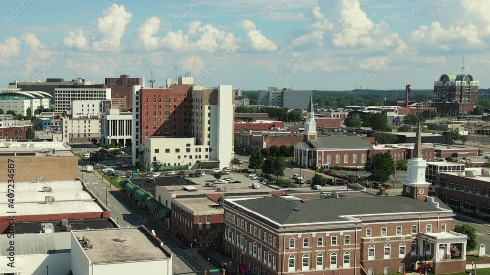 Aerial View of High Point Downtown City District, North Carolina USA. Cityscape, Buildings and Churches on Sunny Day, Drone Shot