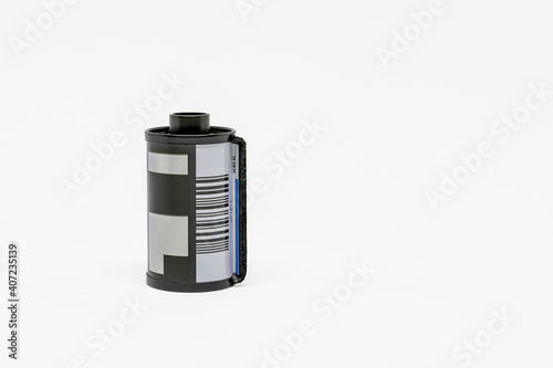35mm film cassette on white background