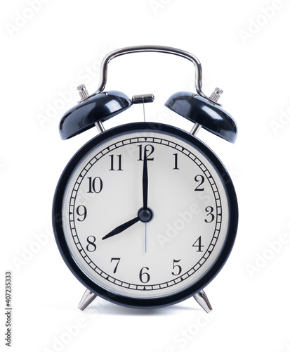 Closeup retro black alarm clock isolated on white background with clipping path, top view