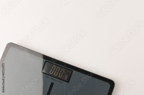 Bathroom scales on white background. Weight loss concept. Selective focus.