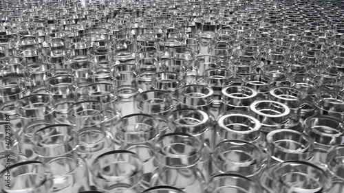 Vaccine manufacturing: Rotating table with unlabelled glass vials, closeup. photo