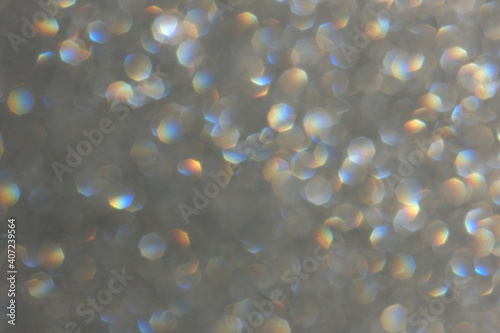 Bokeh background. Glowing circles on defocused light abstract background. 