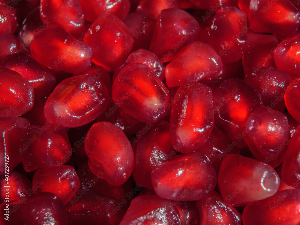The grain of pomegranate is close-up. Super macro. The grain of pomegranate is close-up. Super macro.