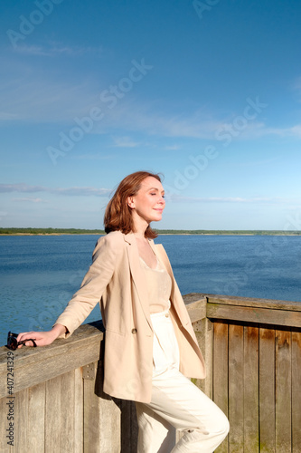 Beautiful romantic brunette adult woman posing outdoors