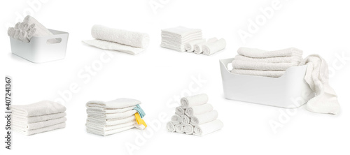 set of white spa towels stacked and in basket isolated on white background