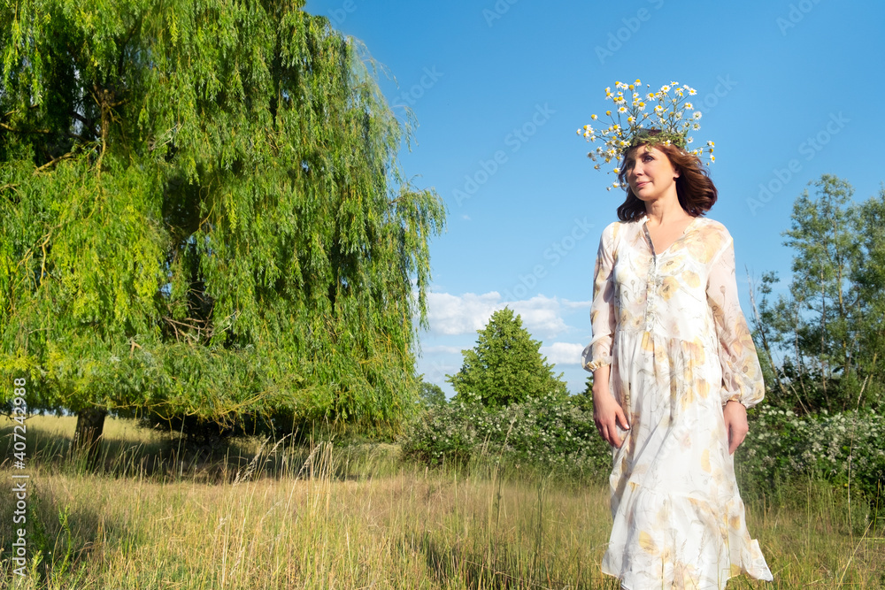 Fototapeta premium Beautiful romantic brunette adult woman posing outdoors