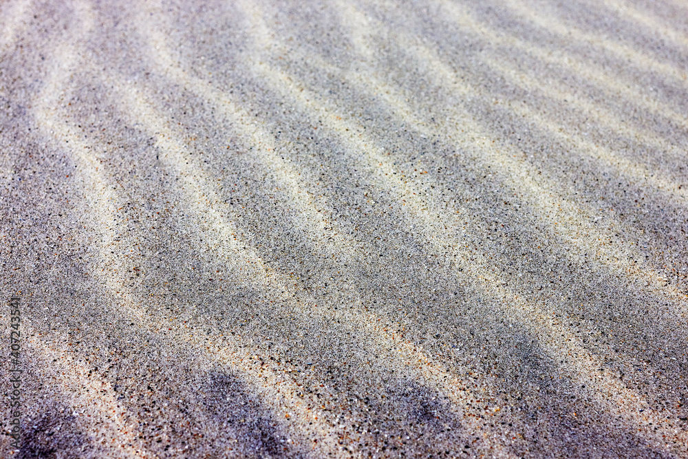 Closeup of sand pattern of a beach in the summer Closeup of sand pattern of a beach in the summer