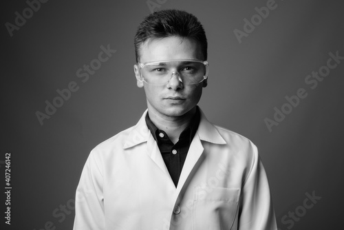 Portrait of young handsome man doctor as scientist © Ranta Images