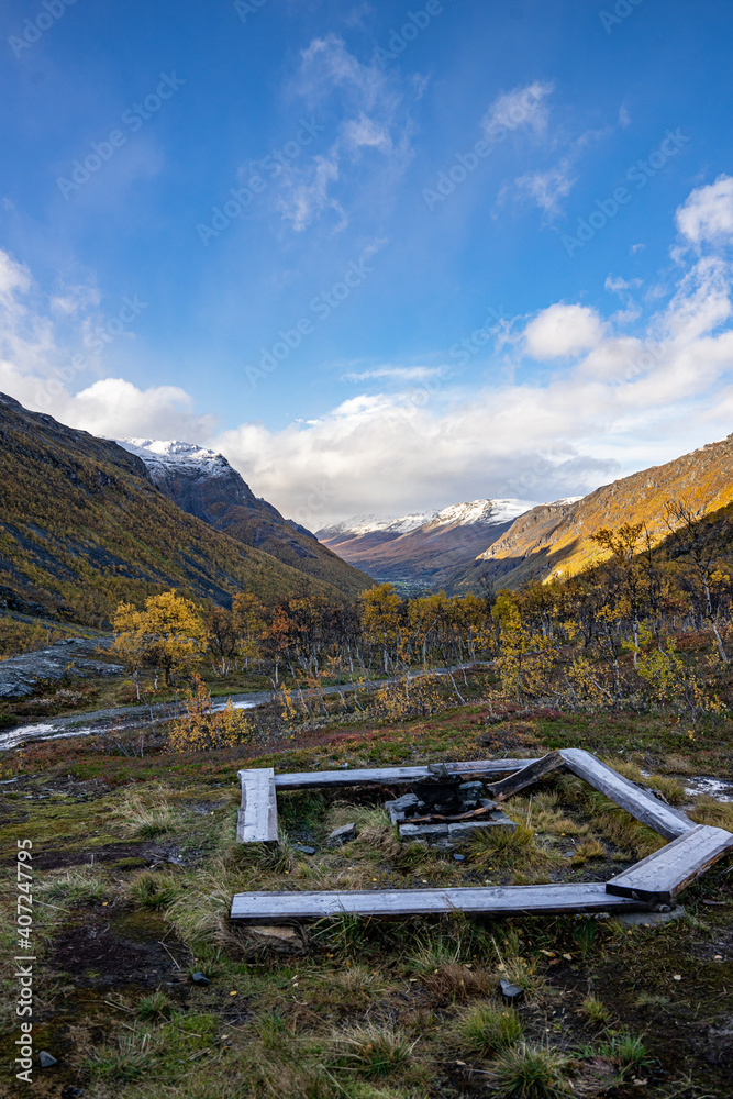 Yellow valley with snow mountains on the side near Skibotn in Norway