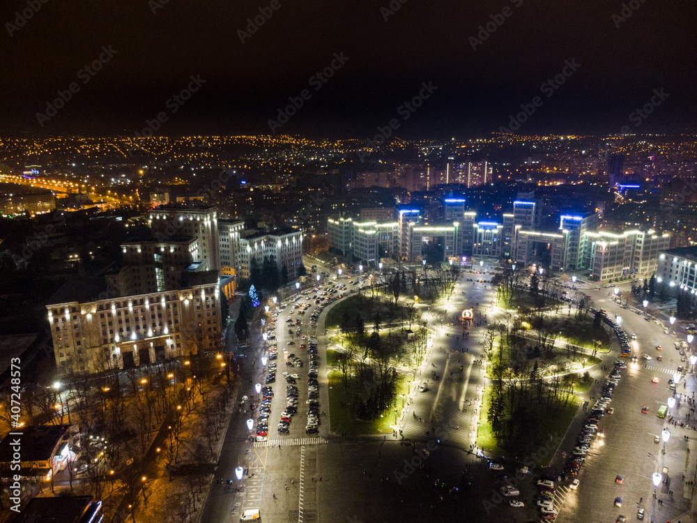 Aerial night view with holidays illumination lights of Derzhprom and Karazina National University on Freedom Svobody Square Kharkiv, Ukraine Aerial night view with holidays illumination lights of Derzhprom and Karazina National University on Freedom Svobody Square Kharkiv, Ukraine