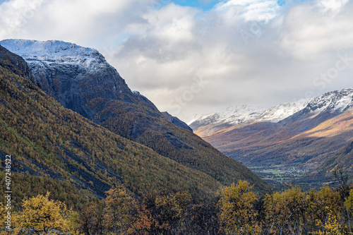 Yellow valley with snow mountains on the side near Skibotn in Norway