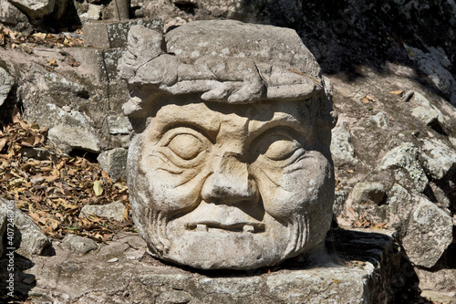 Copan, Honduras, Central America: Carved old man head. Copan is an archaeological site of the Maya civilization, not far from the border with Guatemala