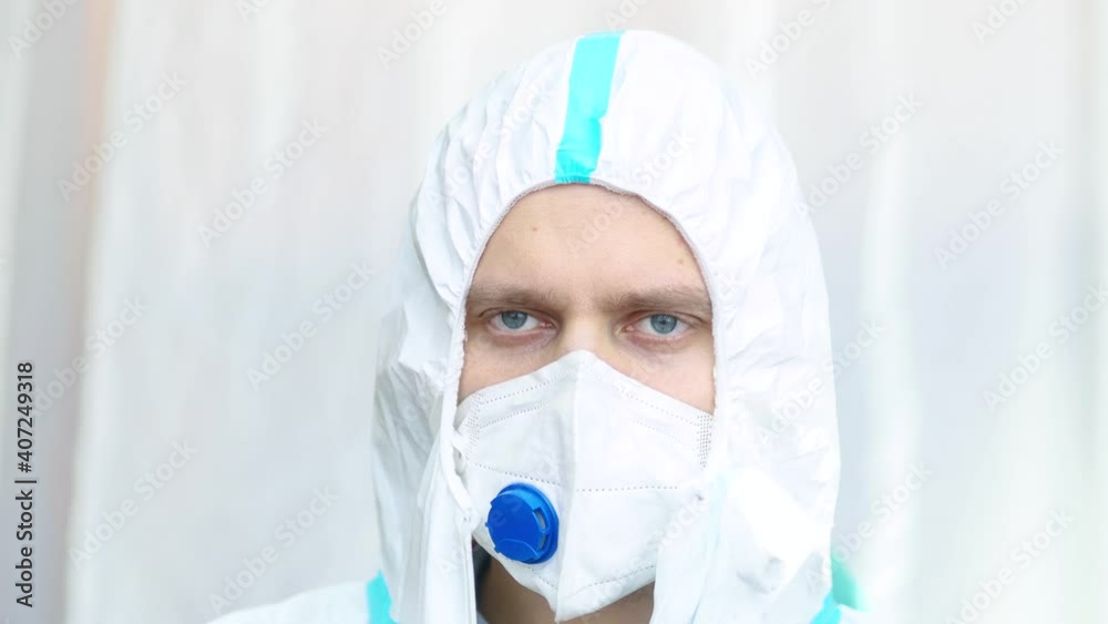 male physician in an epidemiologist's spacesuit. male physician in an epidemiologist's spacesuit.