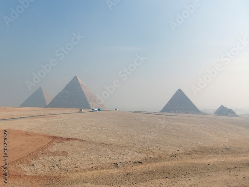 Pyramids of Giza in Cairo with heat haze over the desert. The oldest of the Seven Wonders of the Ancient World.