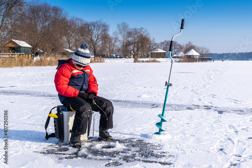 Boy enjoys winter fishing