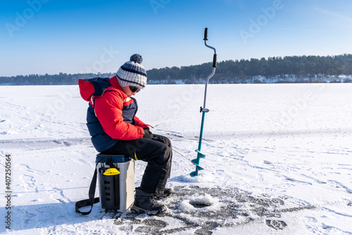 Boy enjoys winter fishing