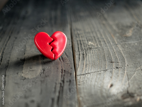 Red love heart on wooden background. Valentine's day concept.