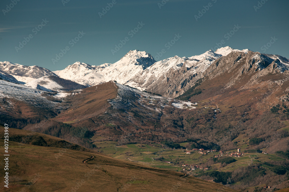 Obeso town with the snowy mountains around it-