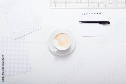 office desk, cappuccino latte , keypad, reminder, directly above