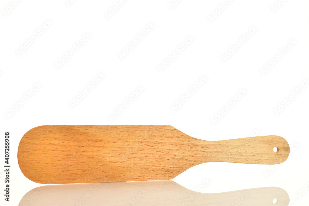 One wooden spatula, for the kitchen, close-up, isolated on white. One wooden spatula, for the kitchen, close-up, isolated on white.