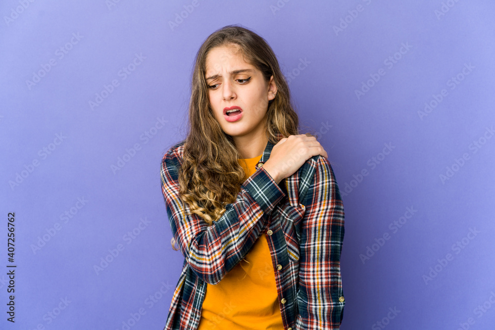 Young caucasian cute woman having a shoulder pain. Young caucasian cute woman having a shoulder pain.