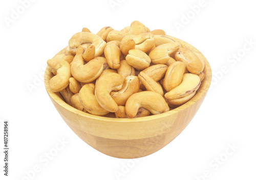 Roasted cashew nuts in wooden bowl isolated on white background	