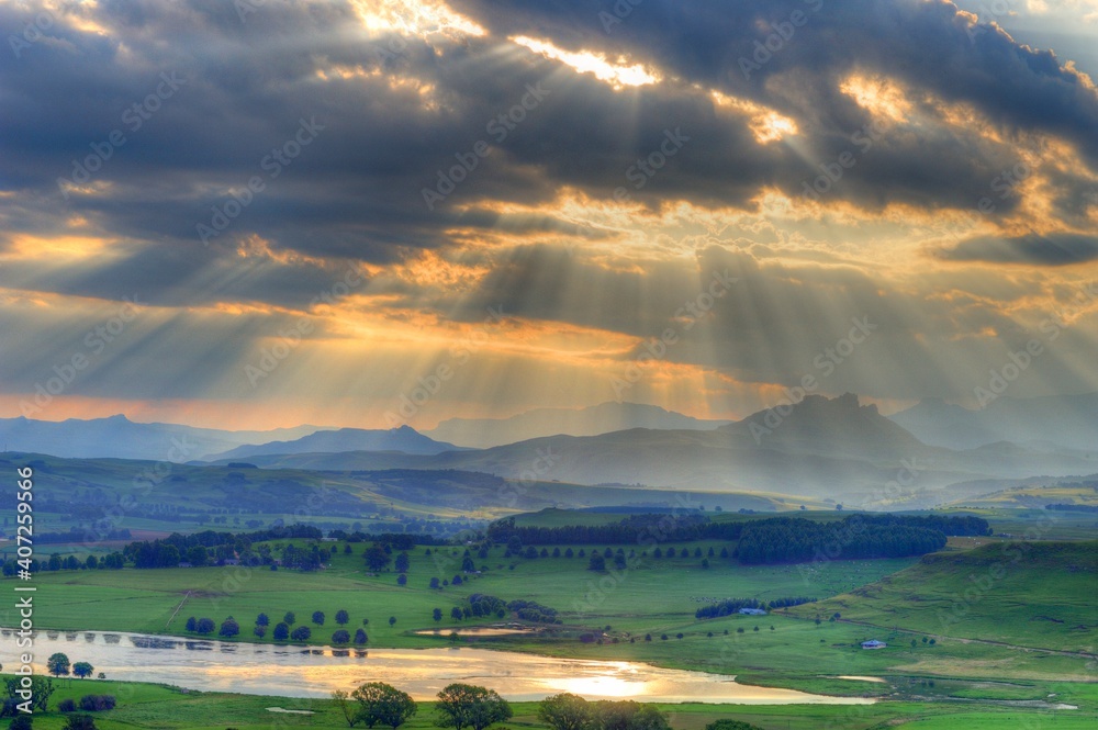 SUNBEAMS, CLOUDS AND MOUNTAINS.  Sunset in the southern Drakensberg, Underberg, kwazulu Natal, South Africa