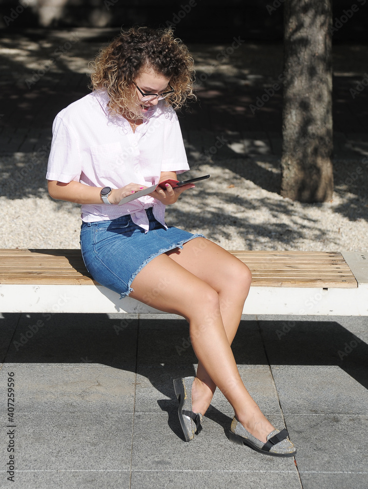 Smiling woman in mask with mobile phone outdoors Smiling woman in mask with mobile phone outdoors