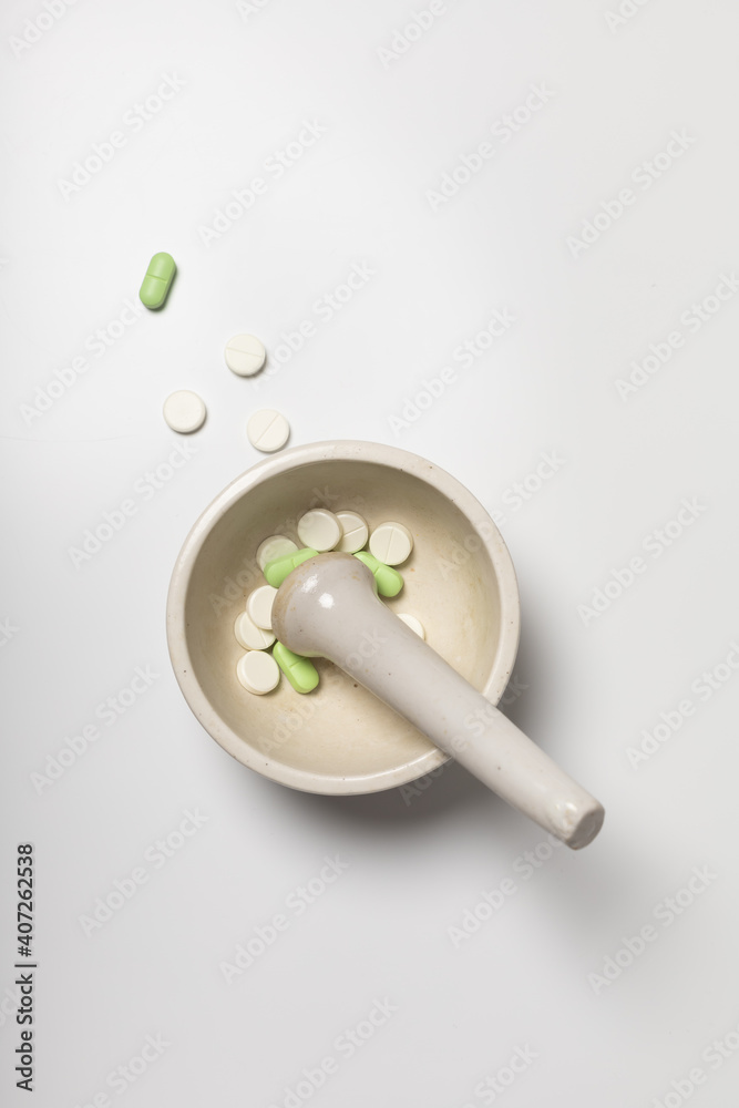 Pills in a pharmacy mortar