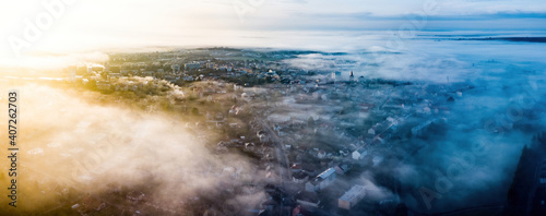 aerial sunrise with fog over the city