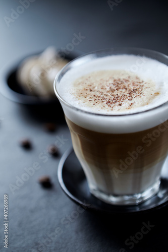 Coffee with milk on dark stone background. Close up.	