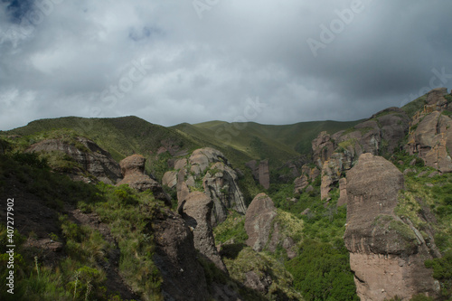 Alpine landscape. Panorama view of the mountains, green forest and rock formations called Los Terrones, in Cordoba, Argentina.