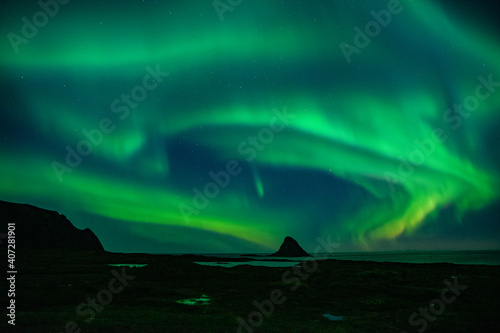 strong northern lights (aurora borealis) in the norwegian wilderness