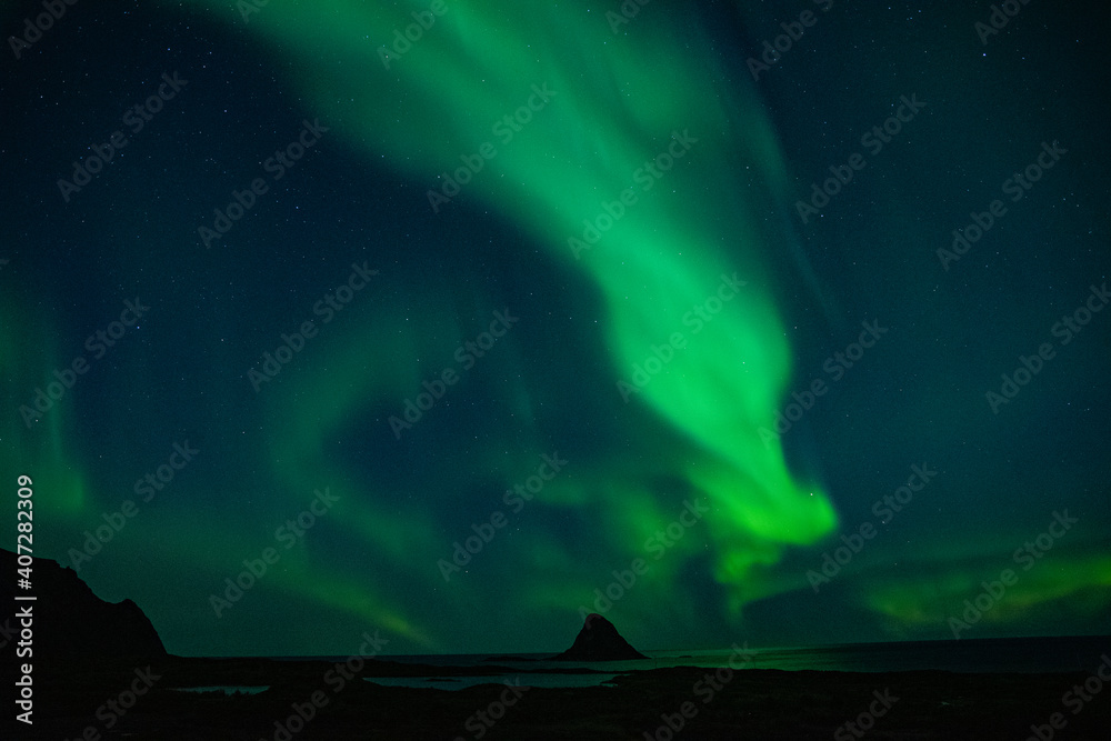 strong northern lights (aurora borealis) in the norwegian wilderness