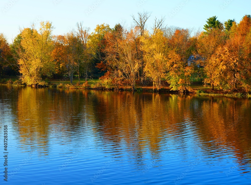 Colorful autumn foliage reflecting in the water in New Jersey, United States Colorful autumn foliage reflecting in the water in New Jersey, United States