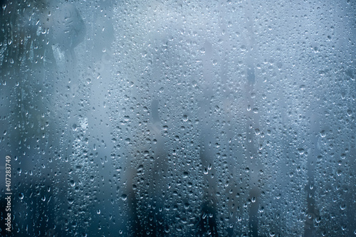 Rainy background, rain water drops on the window or in shower stall, autumn season backdrop, abstract textured wallpaper