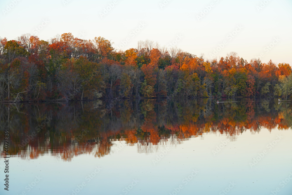 Colorful autumn foliage reflecting in the water in New Jersey, United States