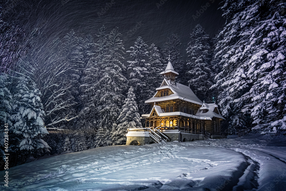 Jaszczurówka - forest chapel in Zakopane during a snowy night